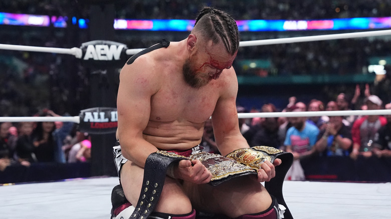 Bryan Danielson celebrates with the AEW World Title