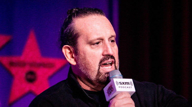 Tommy Dreamer speaking with a microphone