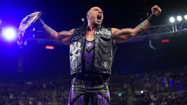 Damian Priest holds up the World Heavyweight Championship while standing on the turnbuckle on "WWE Raw."