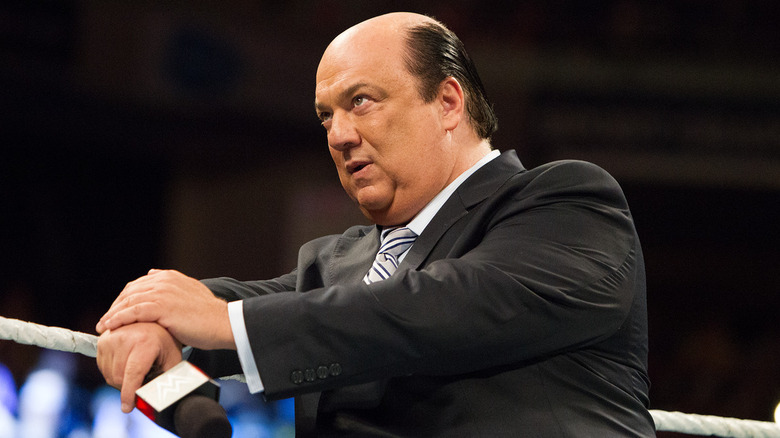 Paul Heyman leaning on the top ring rope in WWE