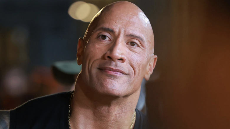 Dwayne "The Rock" Johnson smiles at a Black Adam promotional event.