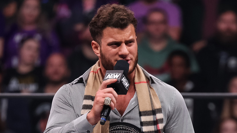 MJF holding AEW microphone