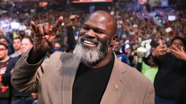 Mark Henry throws up the horns sign