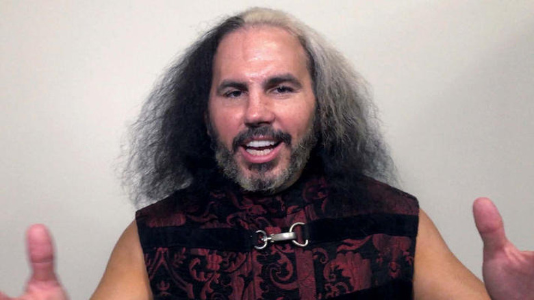 Matt Hardy talking and raising his hands