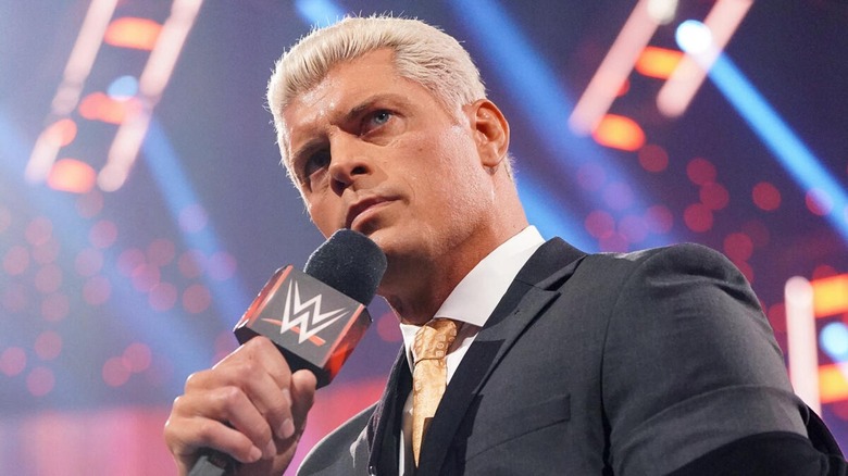 Cody Rhodes holding mic