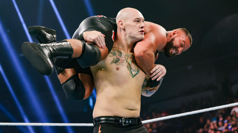 Baron Corbin with Bron Breakker on his shoulders in WWE NXT