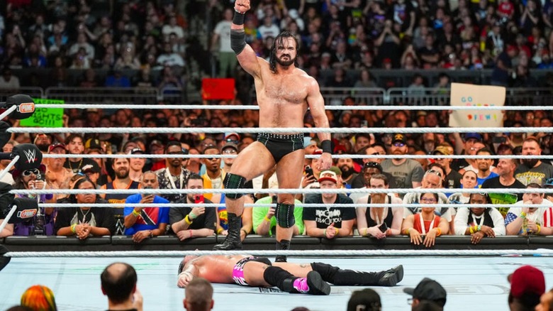 Drew McIntyre stands on a defeated CM Punk