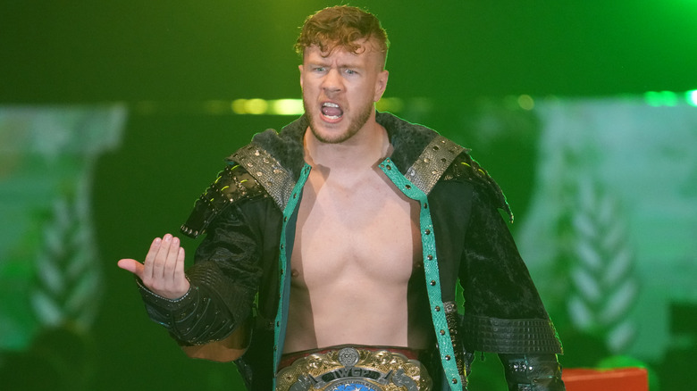 Will Ospreay wearing a green jacket