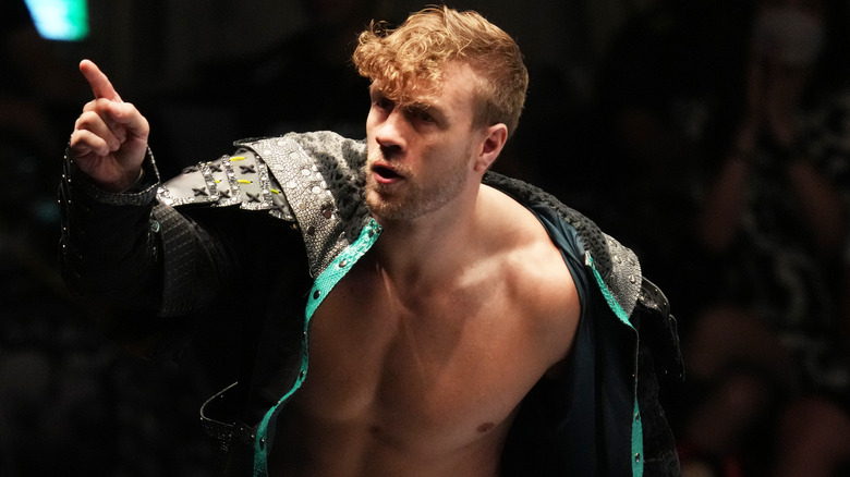 Will Ospreay points to his right