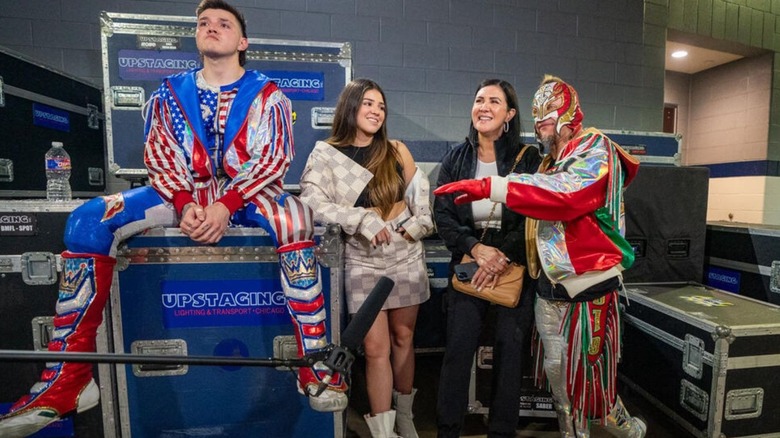 Aalyah Mysterio stands backstage with her family