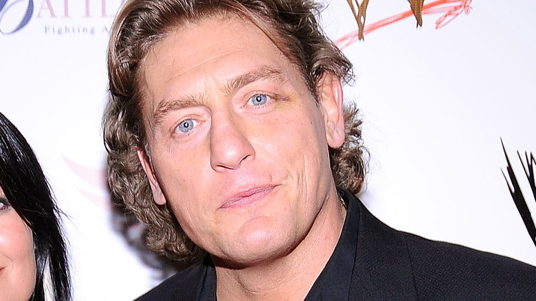 William Regal staring