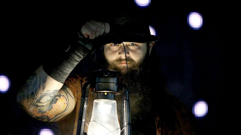 Bray Wyatt holding a lantern