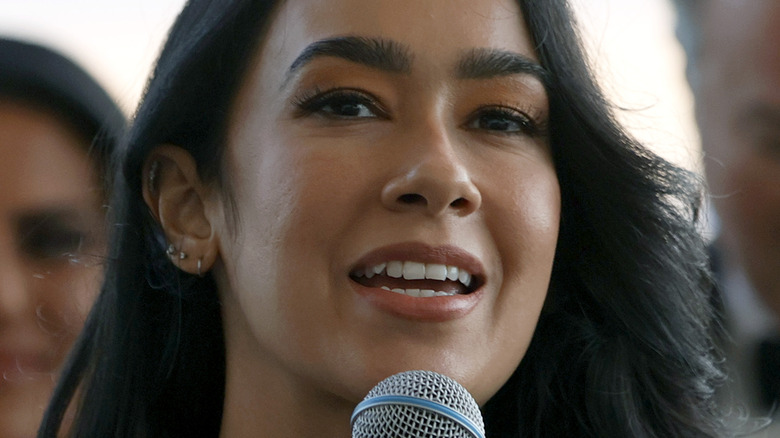 AJ Mendez holding microphone