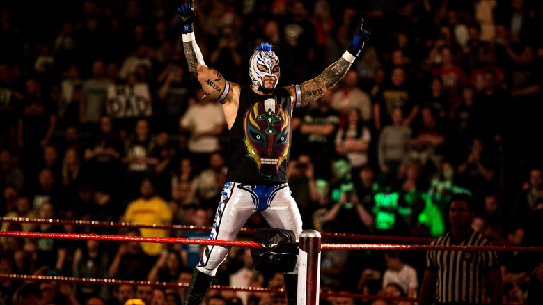 Rey Mysterio poses on the turnbuckle