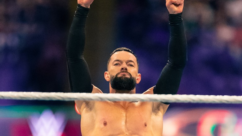 Finn Balor poses in the ring 