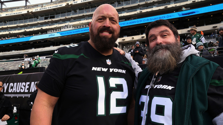 Paul Wight and Mick Foley at football game