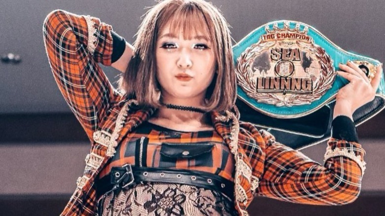 Asuka/Veny with title belt