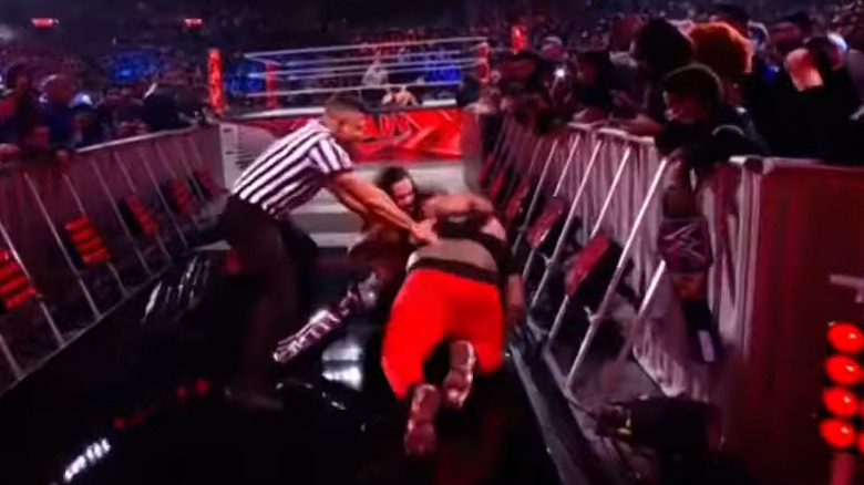 Seth Rollins fighting a fan