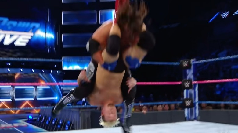 AJ Styles hitting James Ellsworth with a Styles Clash