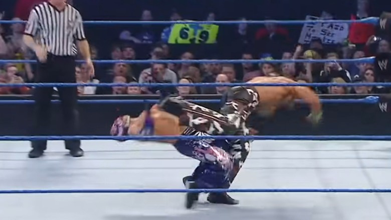 Shawn Michaels hitting Rey Mysterio with Sweet Chin Music