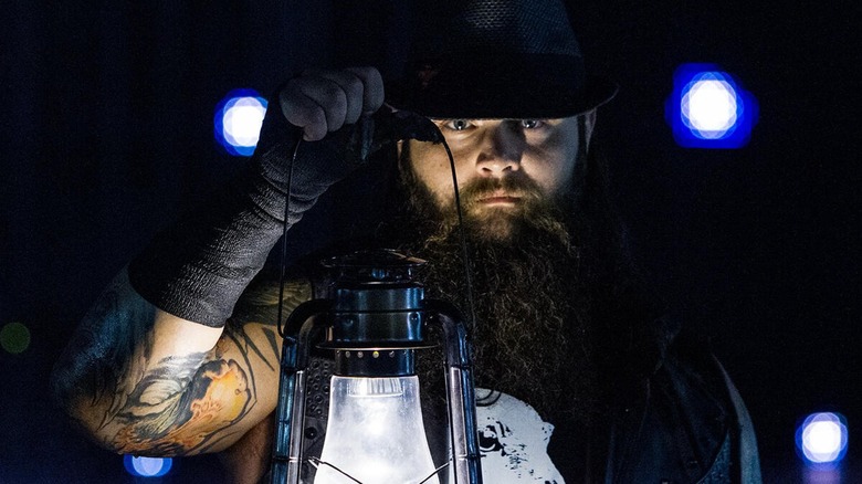 Bray Wyatt holding lantern