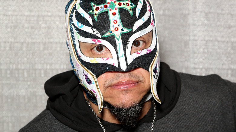 Rey Mysterio looks at camera