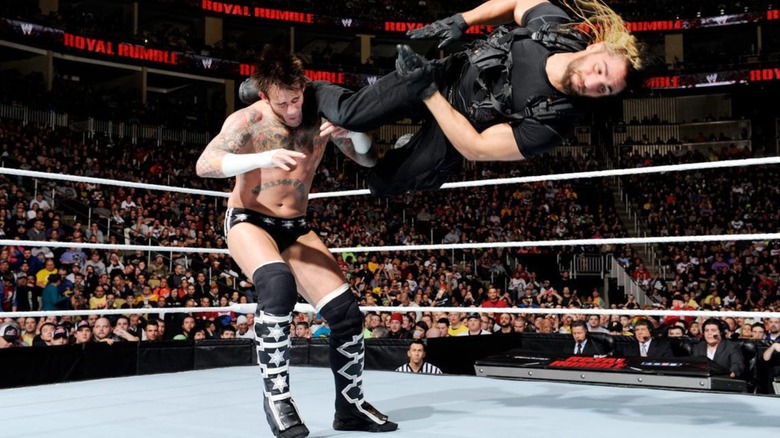 CM Punk being hit by Seth Rollins