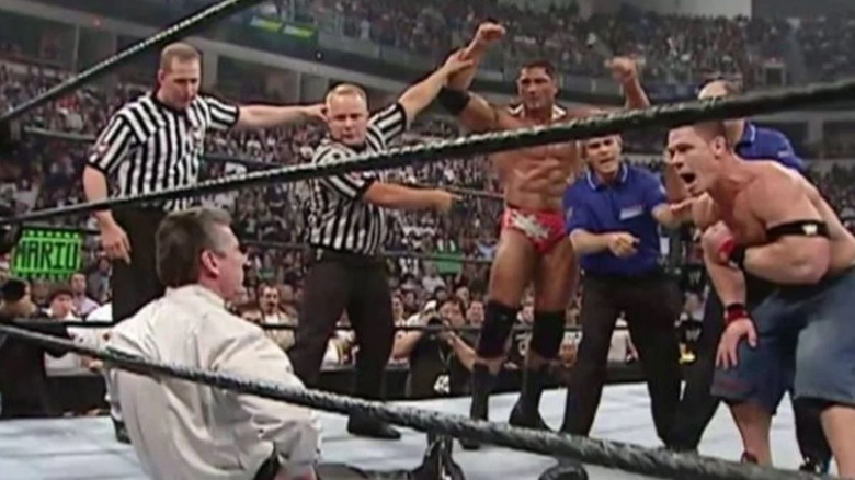 Vince McMahon sitting in the ring