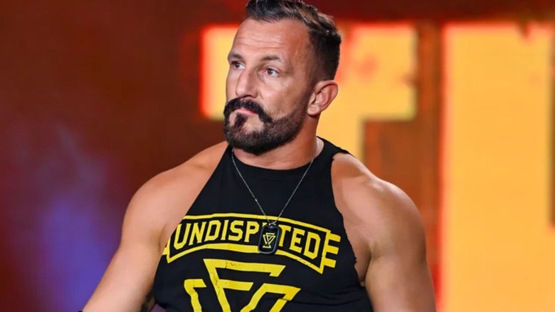 Former WWE talent Bobby Fish stands on the ramp, wearing an Undisputed Era t-shirt, before match on WWE programming.