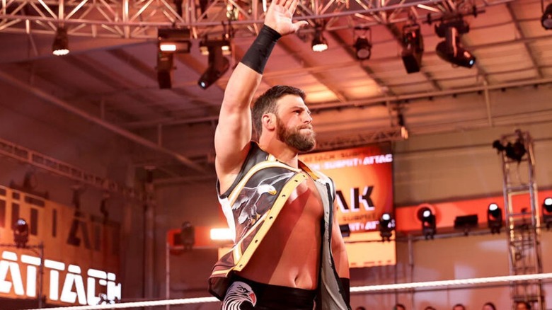 Former WWE talent Drew Gulak poses on the turnbuckle in front of fans at the WWE Performance Center during an episode of "WWE NXT."