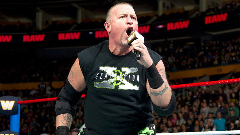 Road Dogg, wearing a D-Generation X shirt, cuts a promo in the middle of the ring during an episode of "WWE Raw."