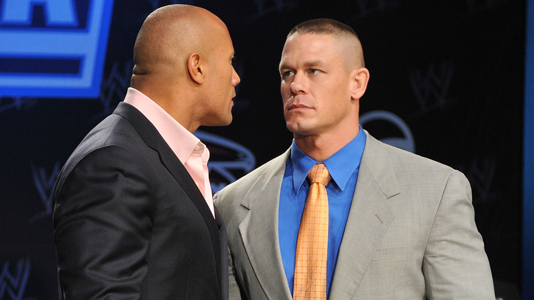 The Rock and John Cena staring each other down