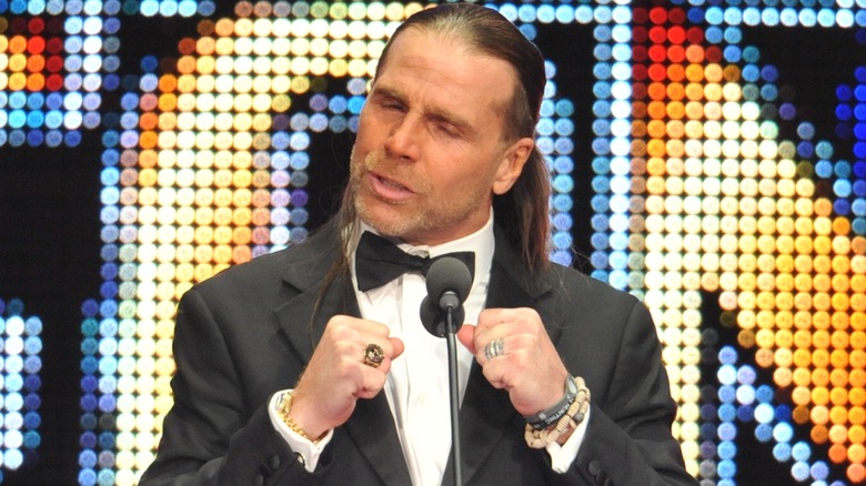 Shawn Michaels pointing to himself at podium during WWE hall of fame speech