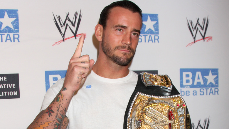 CM Punk with the WWE Championship