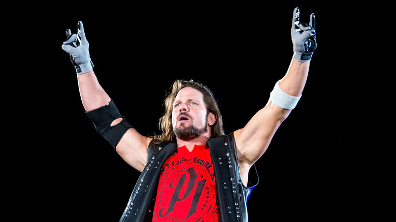 AJ Styles doing Too Sweet gesture