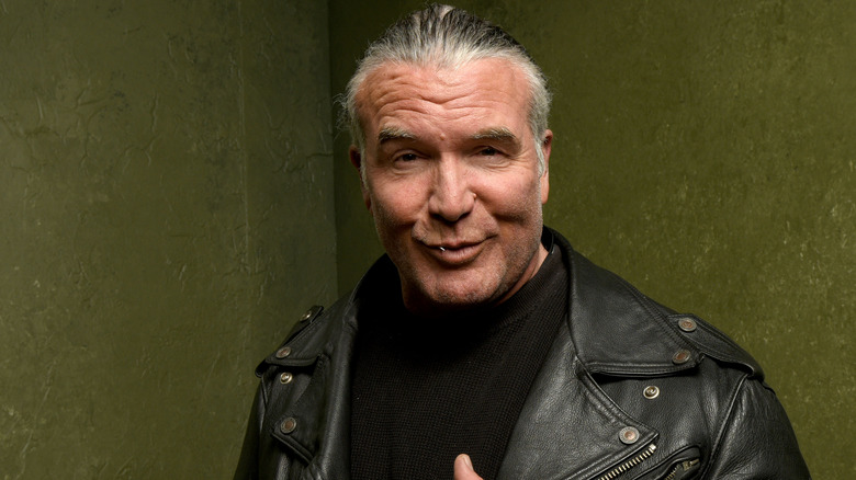 Scott Hall pointing at self with thumbs