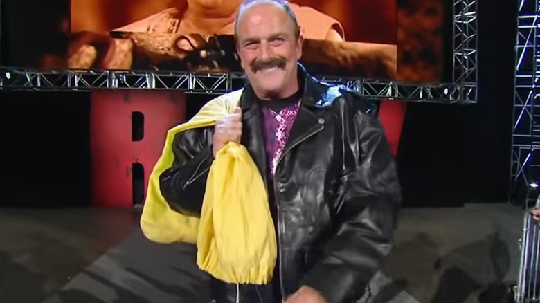 Jake Roberts carrying the snake in a bag