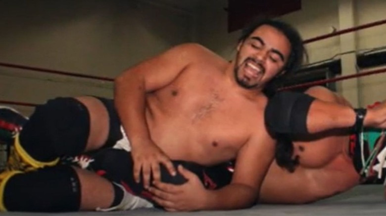 Liger Rivera puts a fellow luchador in a submission