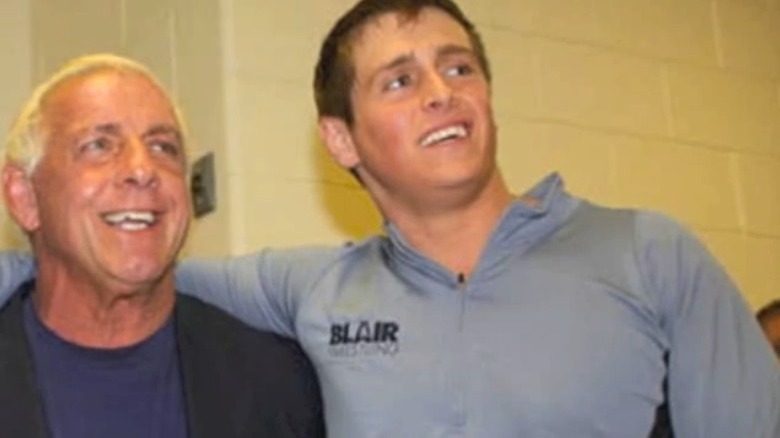 Reid Flair embracing Ric Flair