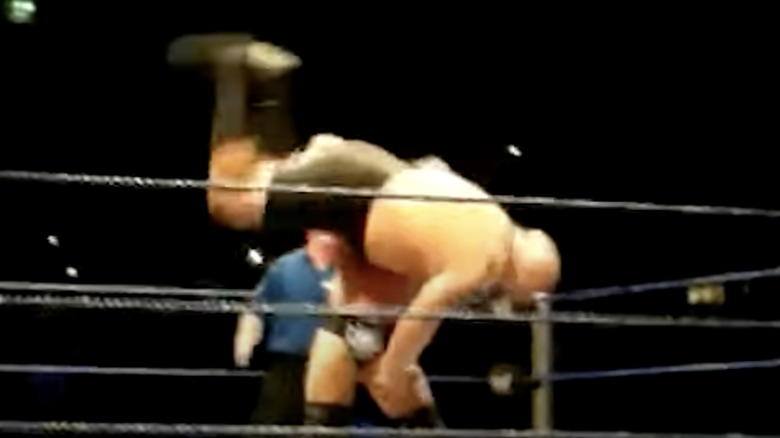 Triple H body slams The Big Show