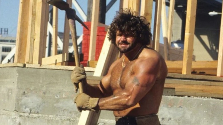 Billy Jack Haynes is pictured holding a tool while working on a construction site.