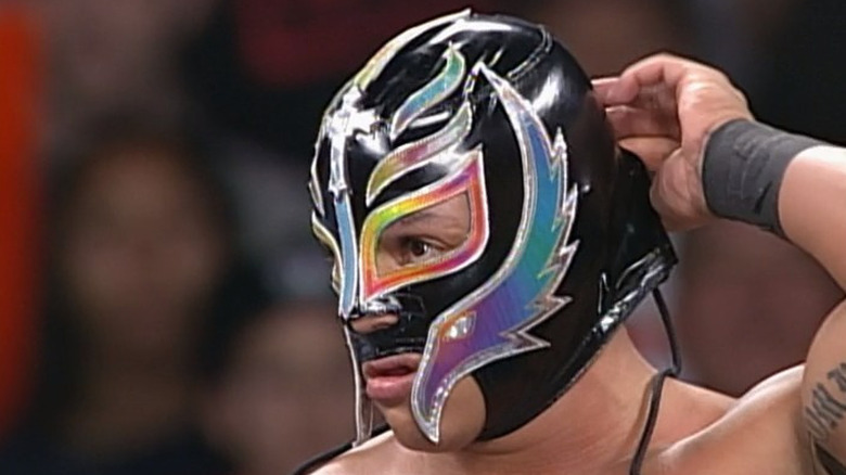 Rey Mysterio removing mask