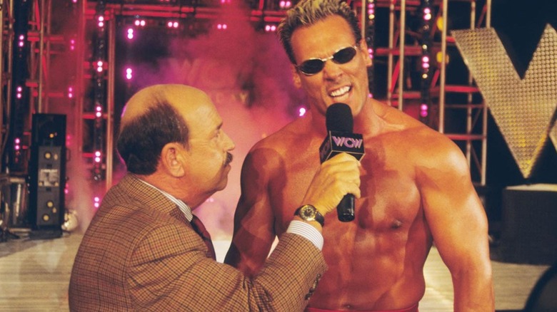 Sting delivers a promo beside "Mean" Gene Okerlund in WCW.
