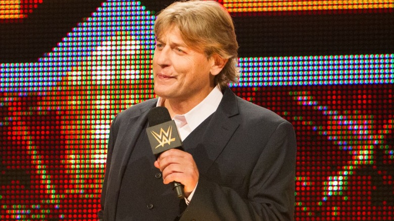 William Regal delivers a promo on the stage during an episode of WWE NXT