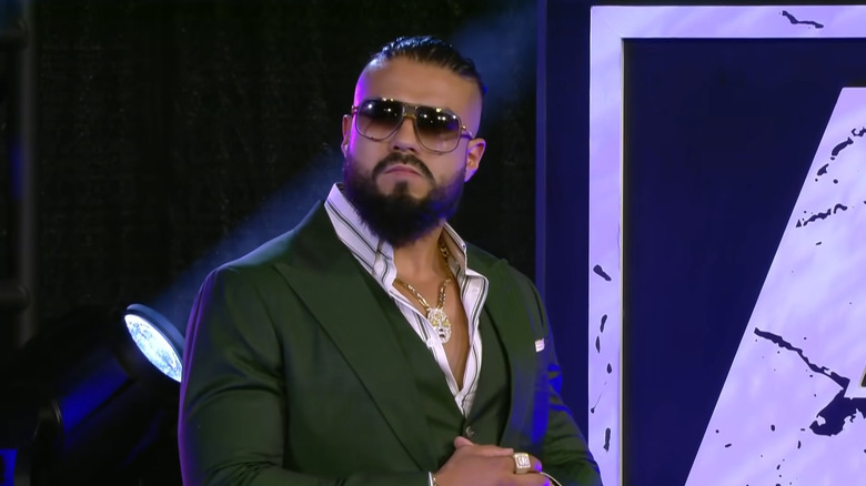 Andrade El Idolo wearing his shades and suit