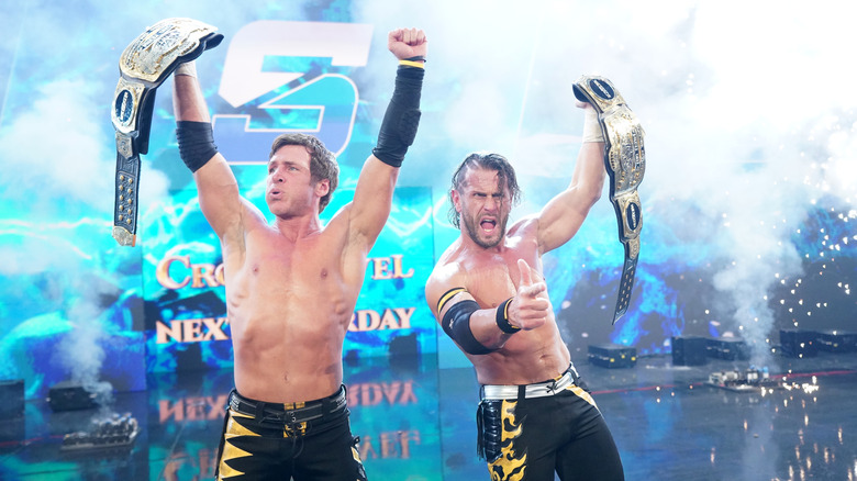 Alex Shelley [right] as WWE Tag Team Champion