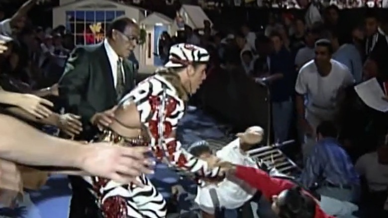 Fans on the ground next to Shawn Michaels