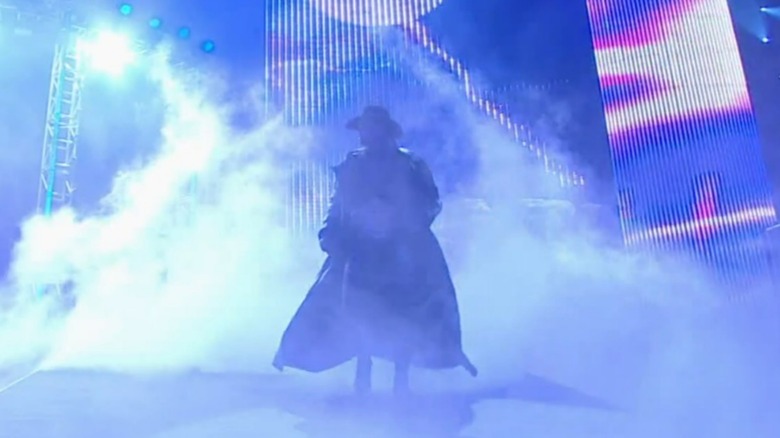 The Undertaker surrounded by smoke