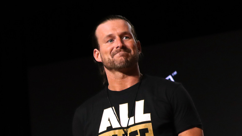 Adam Cole smiling AEW shirt