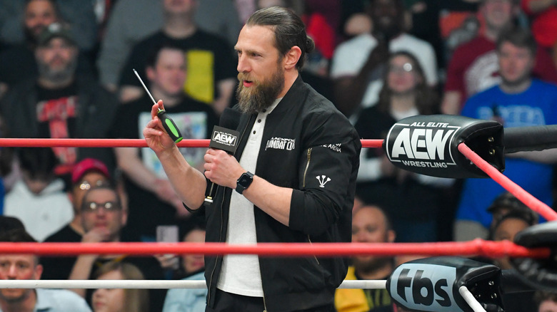 Bryan Danielson holding screwdriver